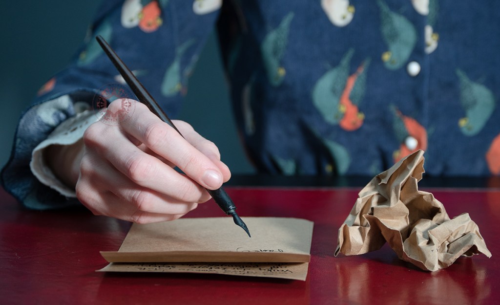 Rasa Mateviciute, rasadesign.art, calligraphy dip pen, picture of lady writing, hand holding pen, handwriting on paper, writings